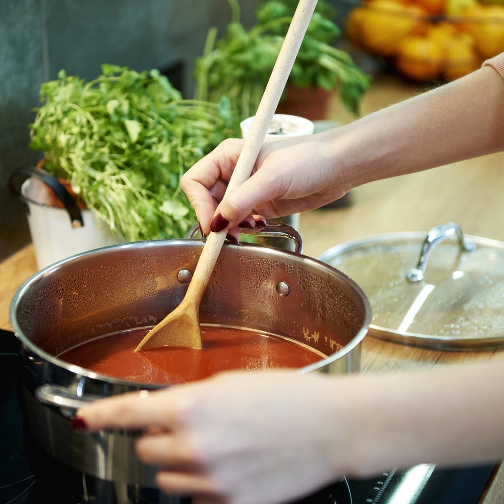 Stirring soup on the stove