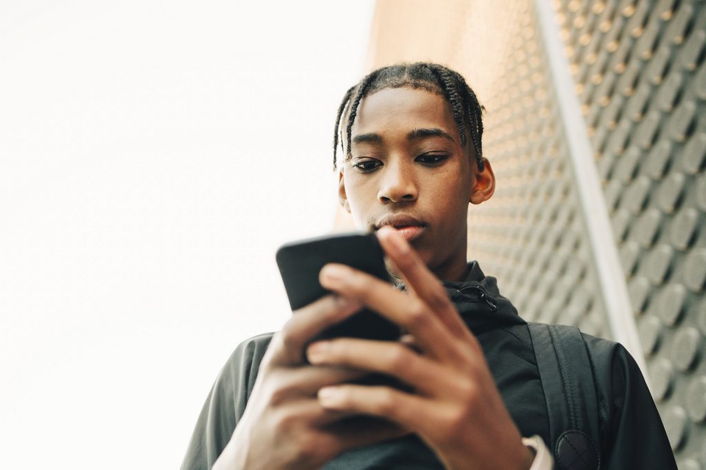 Teen using a cell phone.
