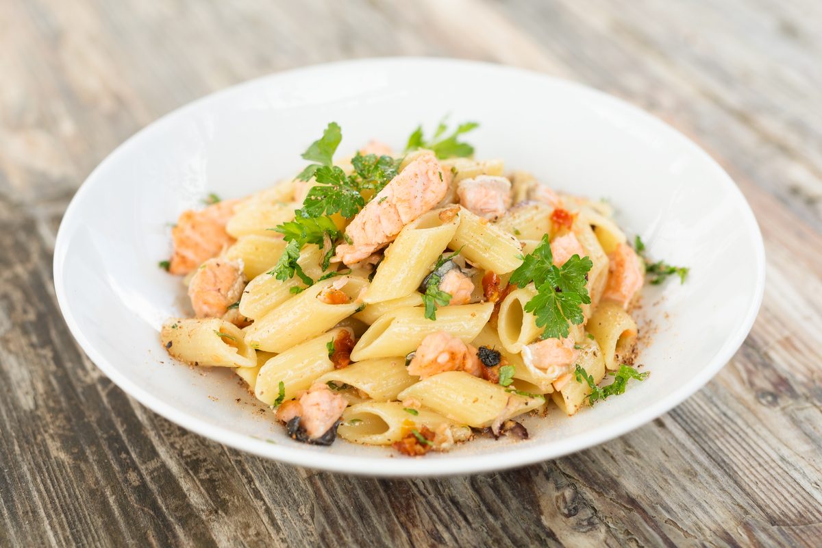 Tasty plate of pasta and salmon