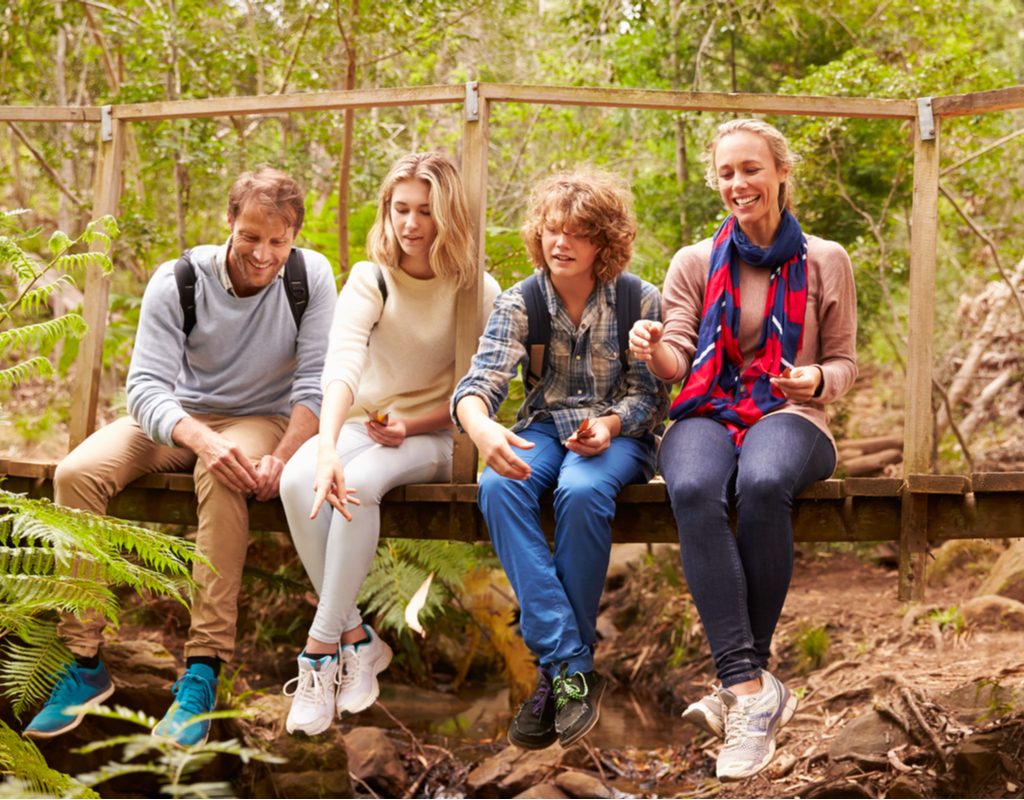 A family taking a break during their hike.