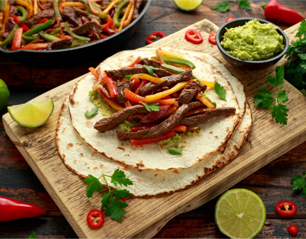 steak fajita on a cutting board ready to eat
