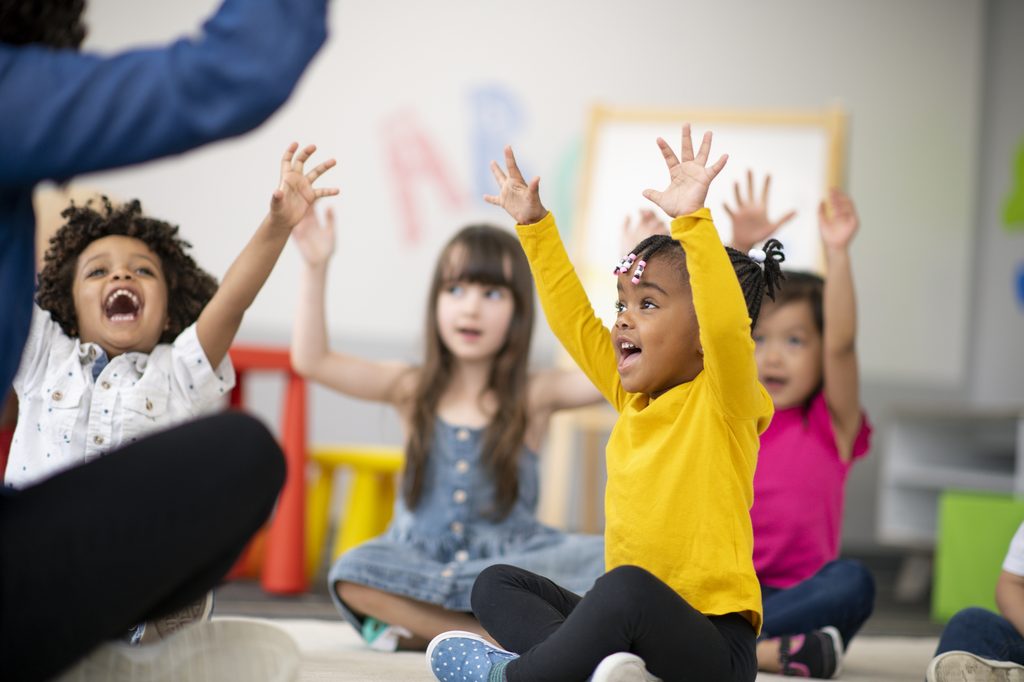 Young children playing a game at day care