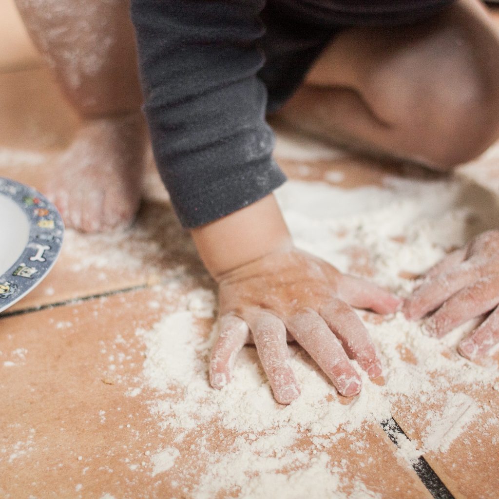 Child playing in flour