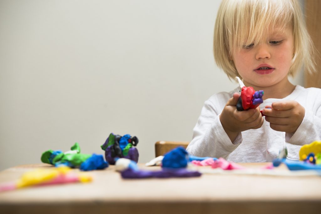 child using clay