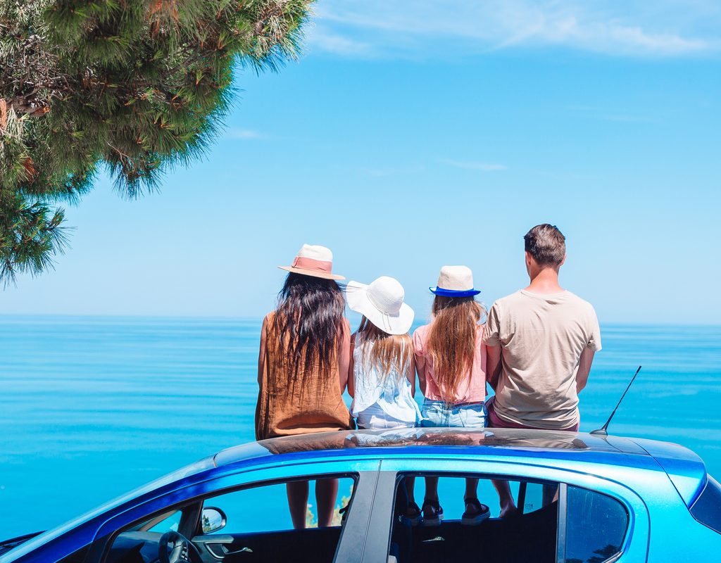 A family on vacation taking a break to look at the view