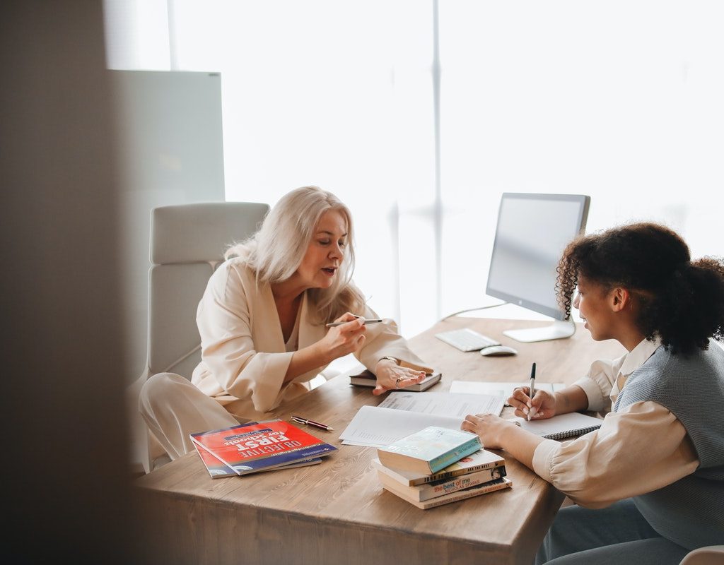 Tutor working with student
