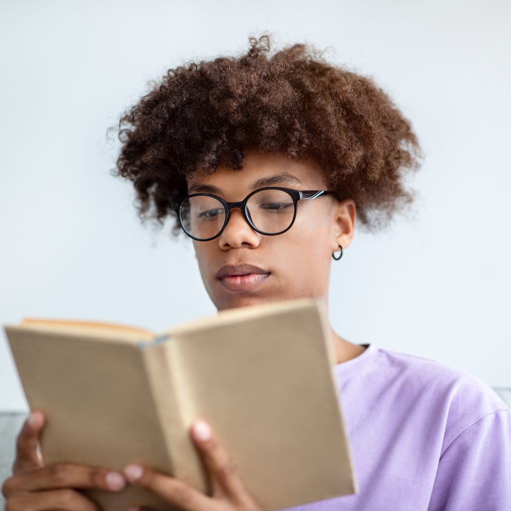 Teen reading a book