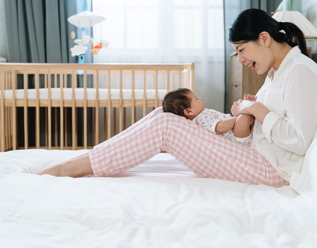 A mother singing to her little baby