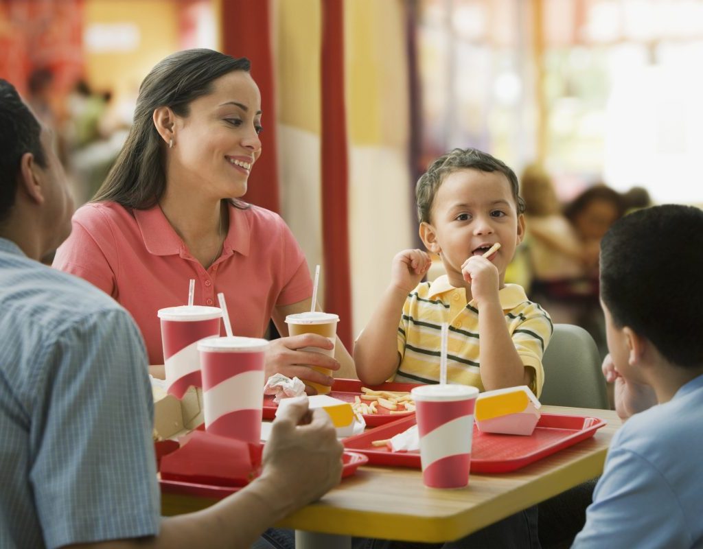 A family enjoying a fast food meal together.