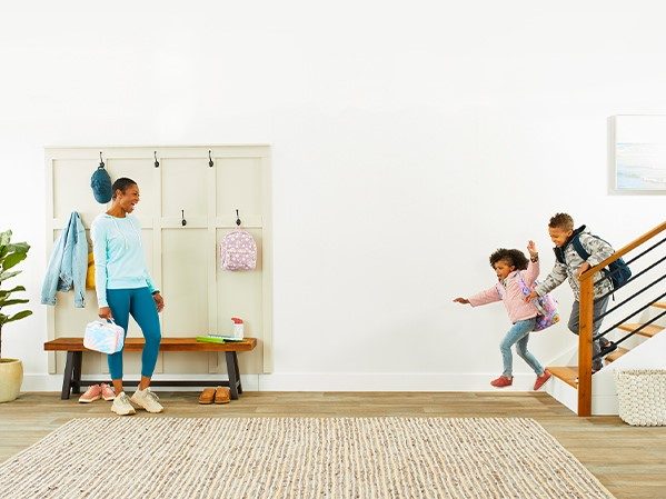 Two kids heading to school in the morning.