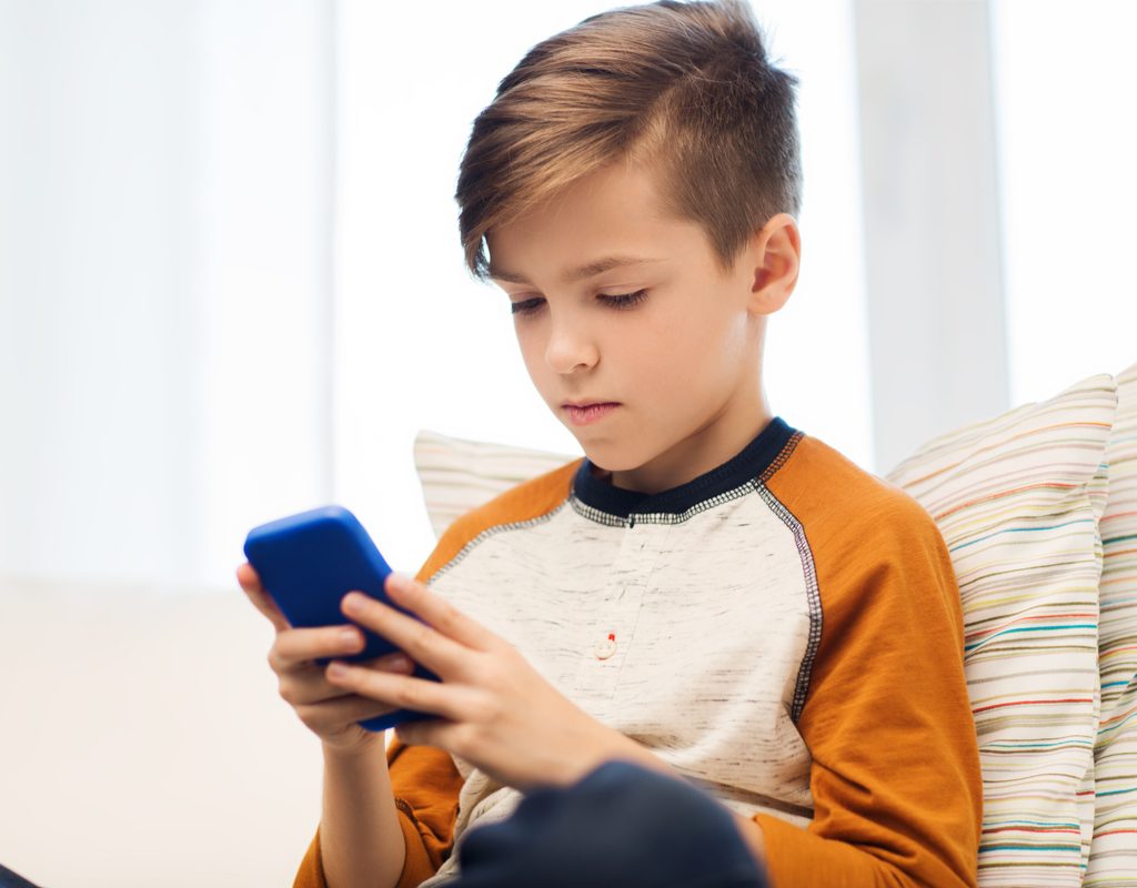 Boy using cell phone responsibly