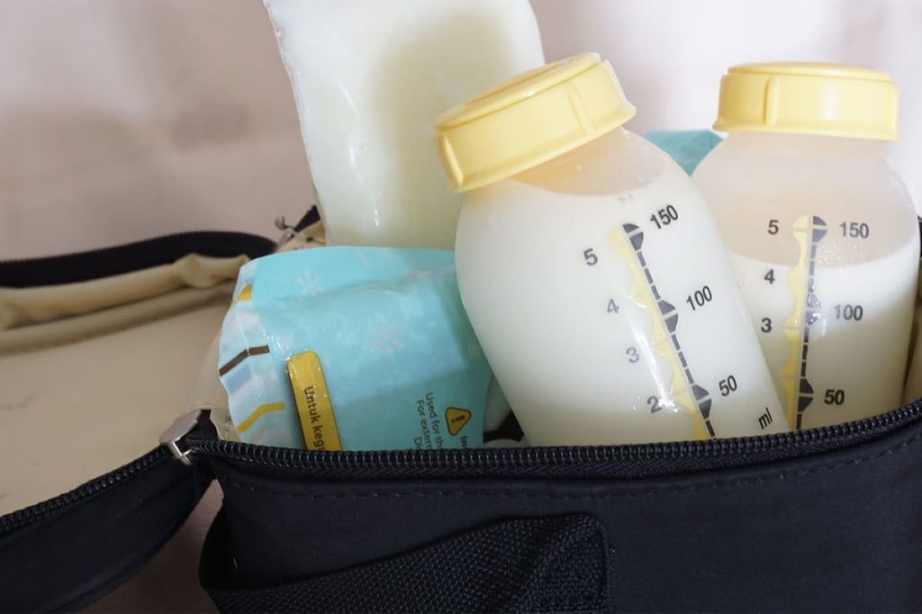 milk storage containers in diaper bag