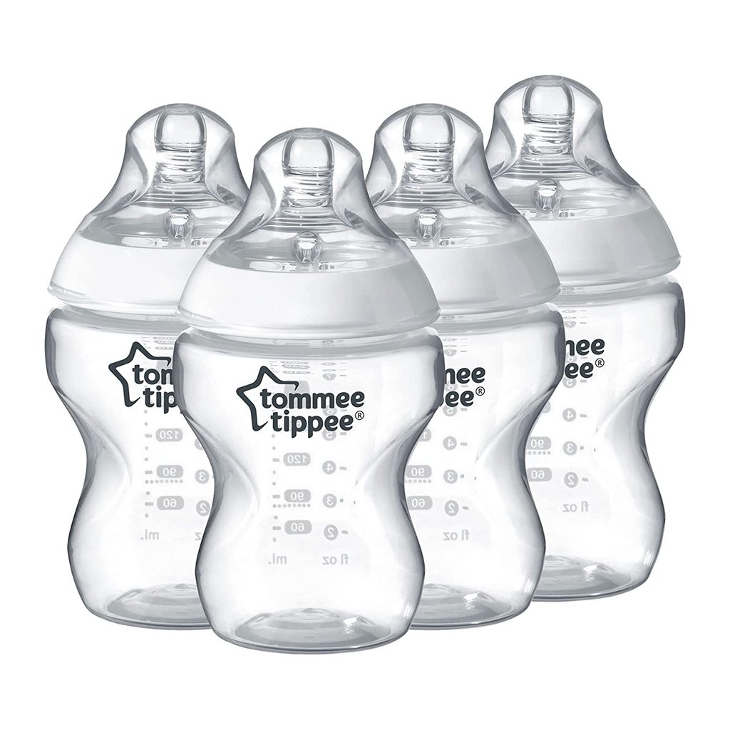 Four empty baby bottles on a white background.