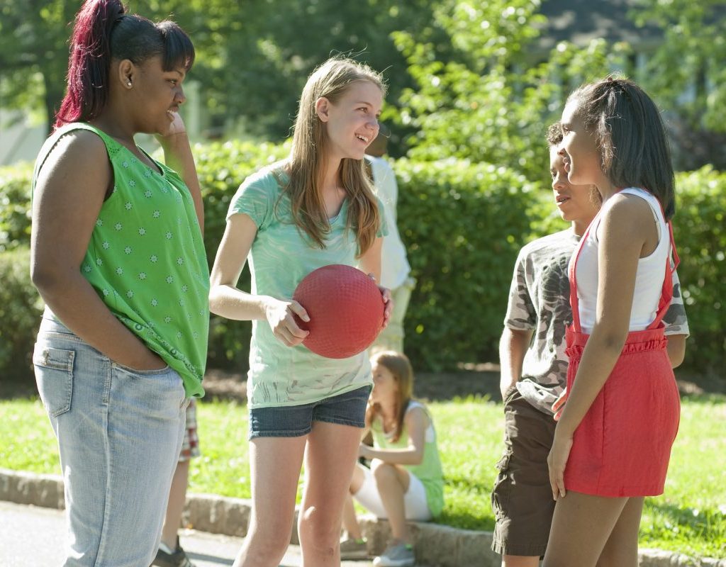 A group of kids about to play kickball.