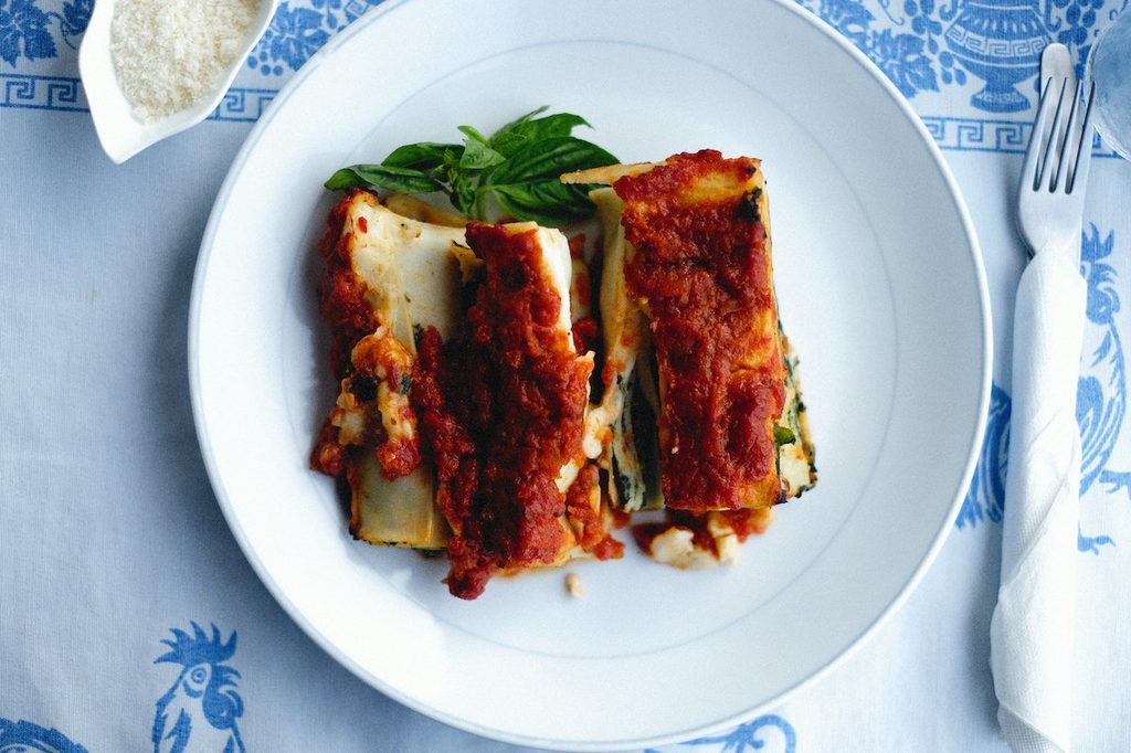 Lasagna roll-ups on a white plate
