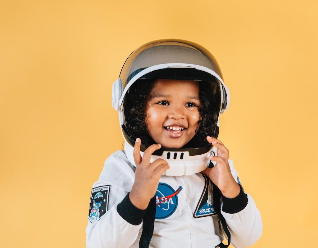 Little girl in an astronaut costume