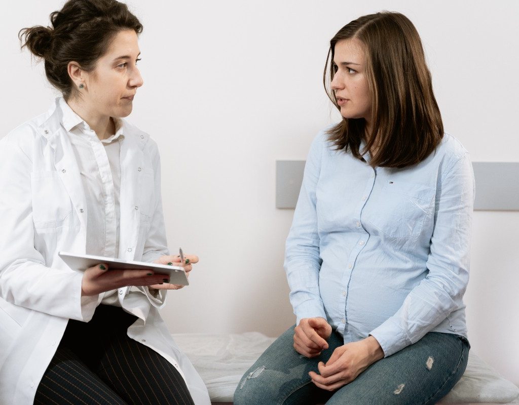 Pregnant person asking doctor questions