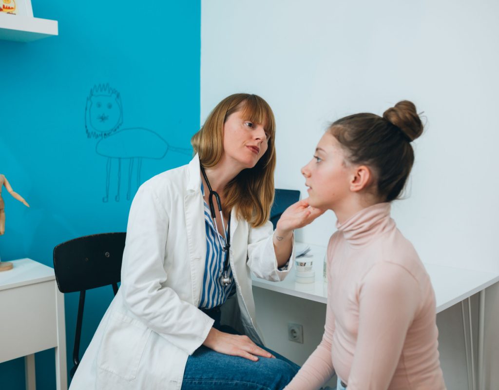 Teen girl talking to a dermatologist