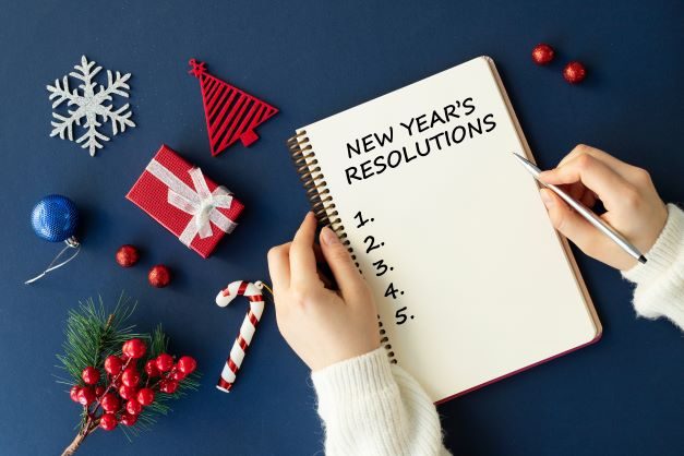 New Year's resolutions written on a notebook.