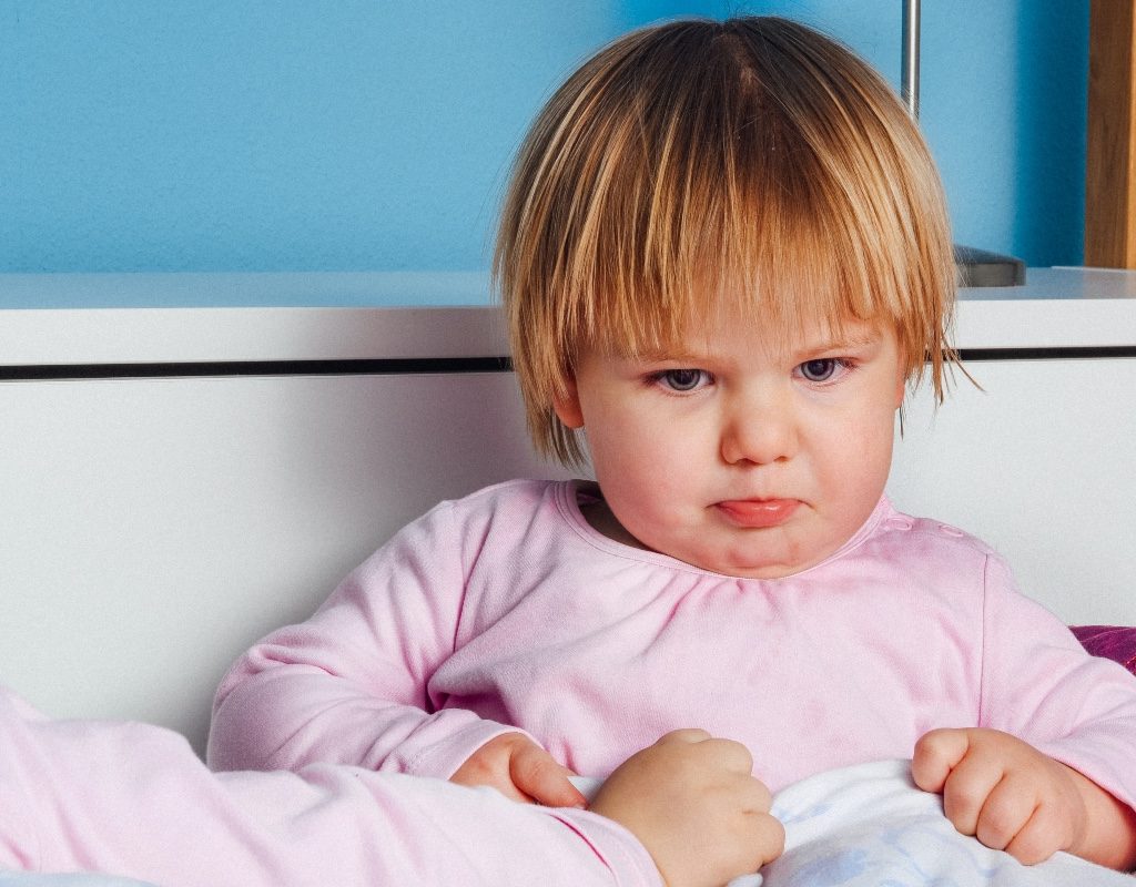 Angry toddler in pink