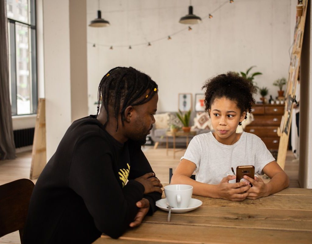 Dad talking to daughter