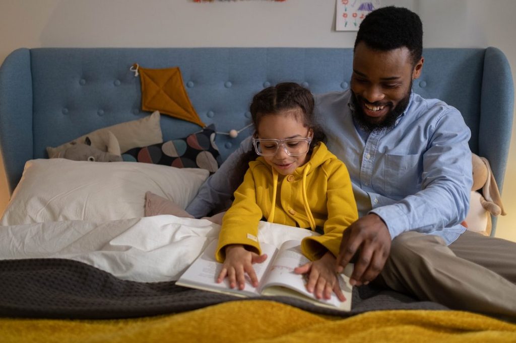A father reading to a child
