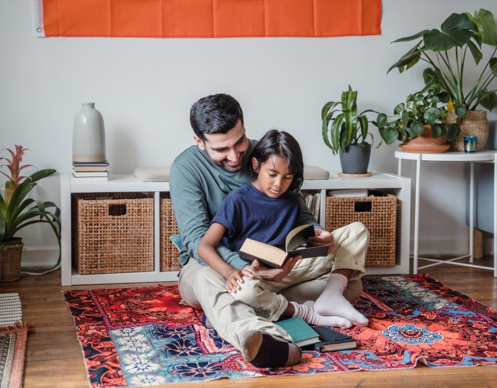 A parent reading to a child