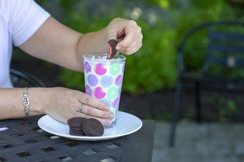 Dunking Raspberry Rally in milk
