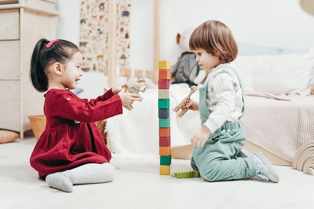 Children playing in a Montessori bedroom