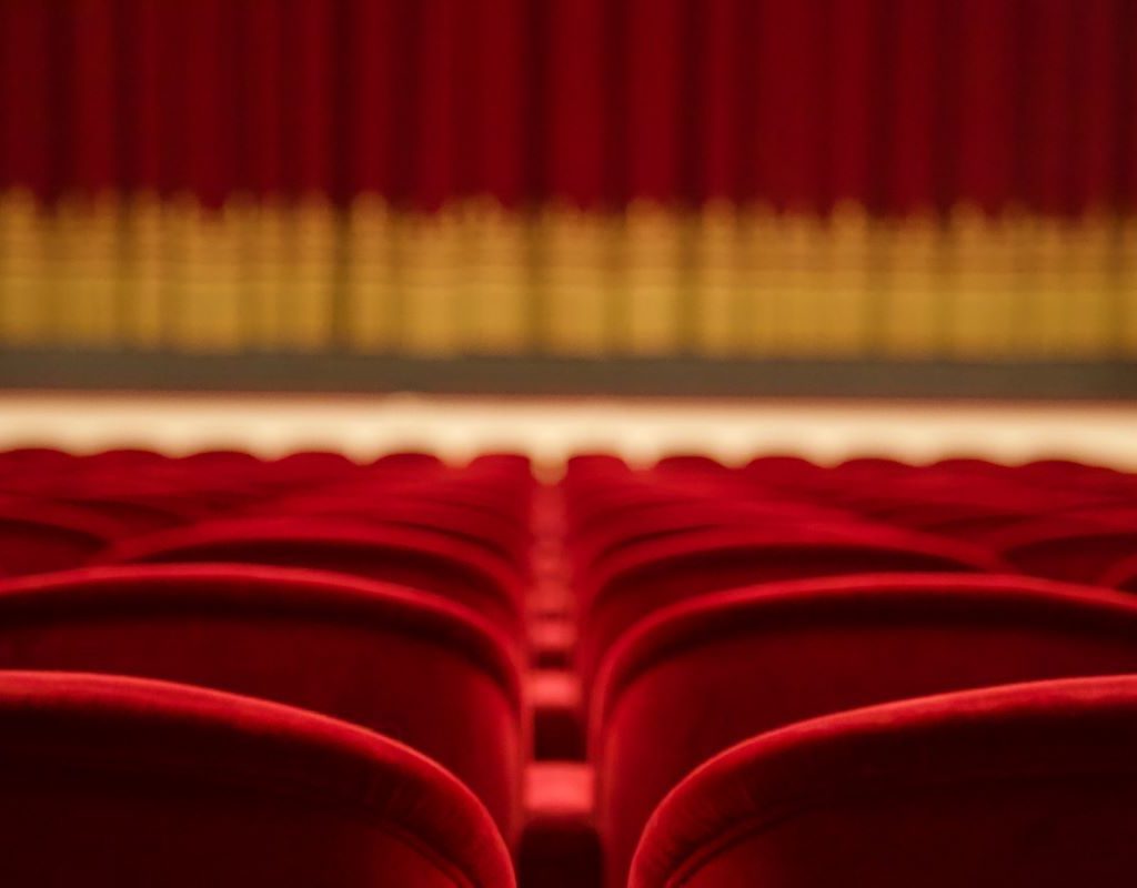 Talent show stage with empty audience seats