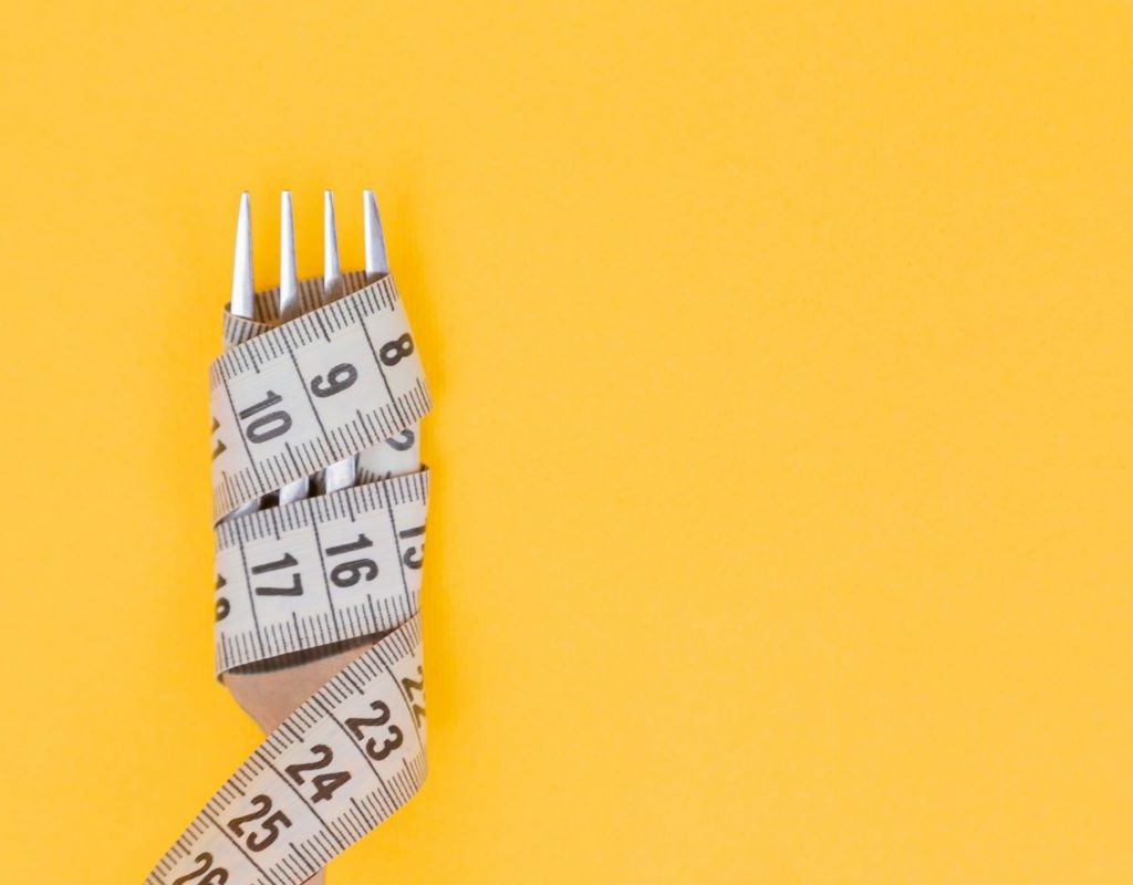 Measuring tape around a fork