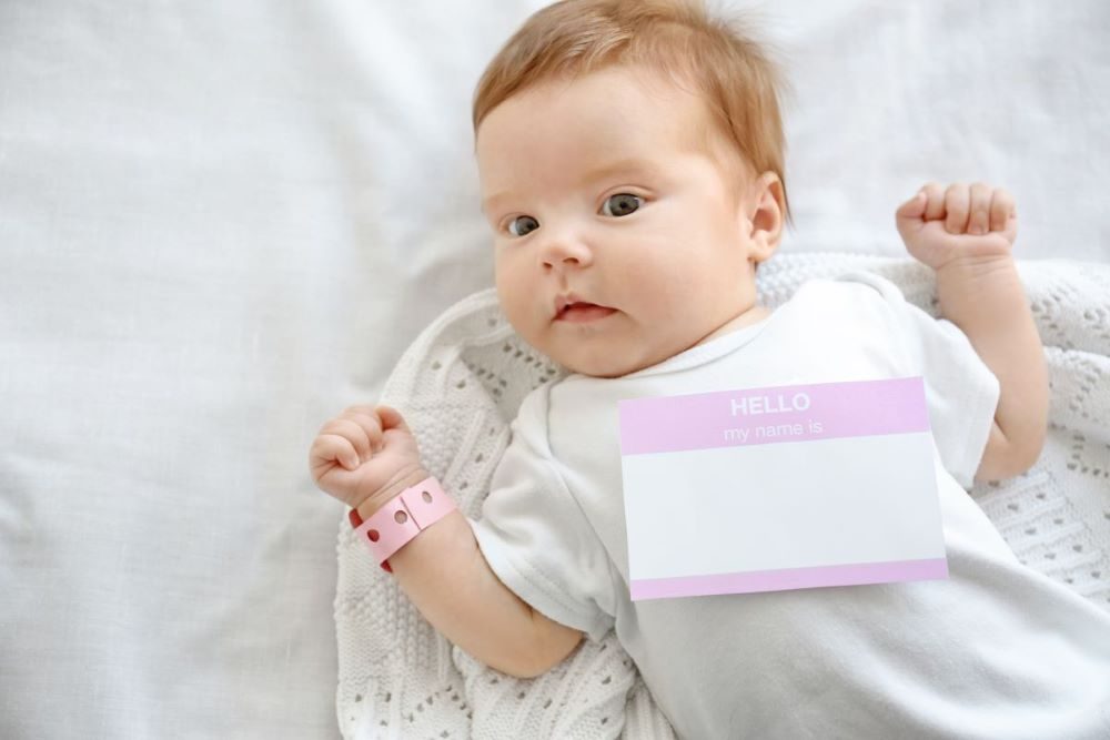 Cute baby with a blank name tag