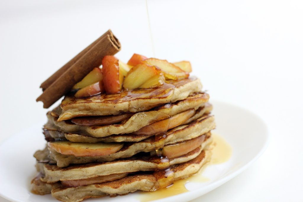 Stack of pancakes with apples and cinnamon