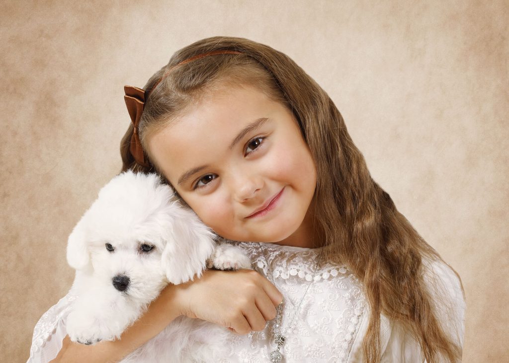 Girl with bichon puppy