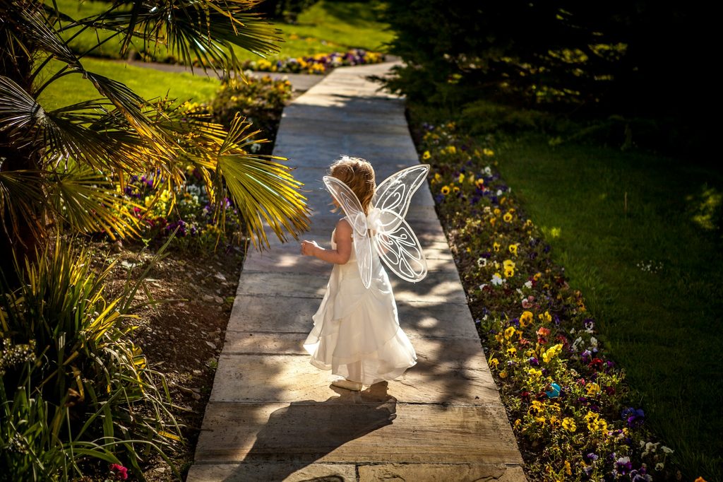 A child wearing butterfly wings.