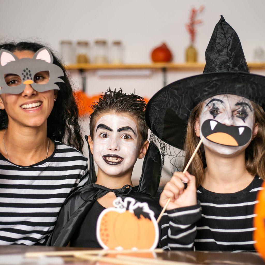 Family of 3 in Halloween costumes