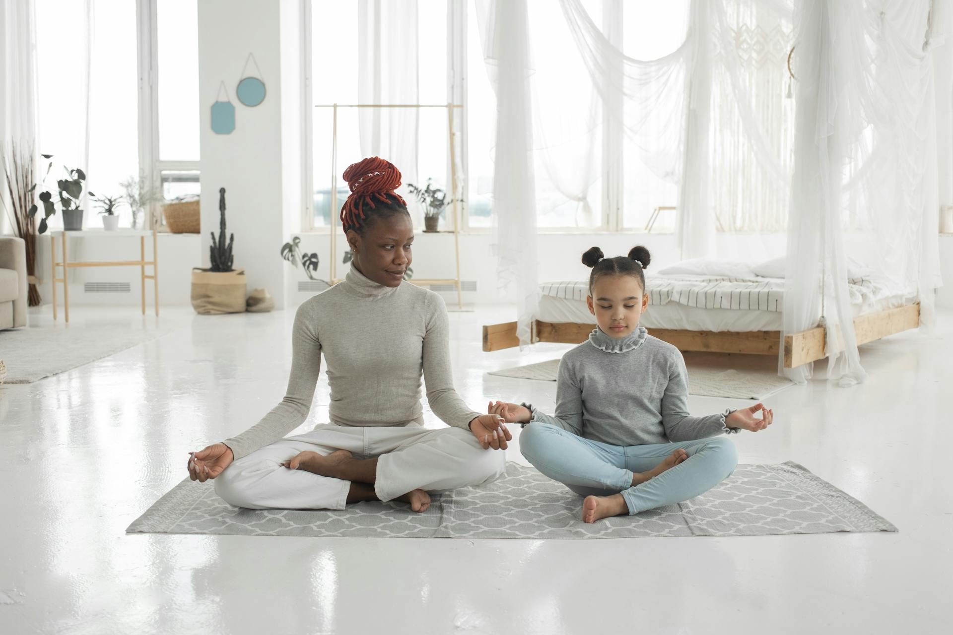 Mother and daughter practicing yoga