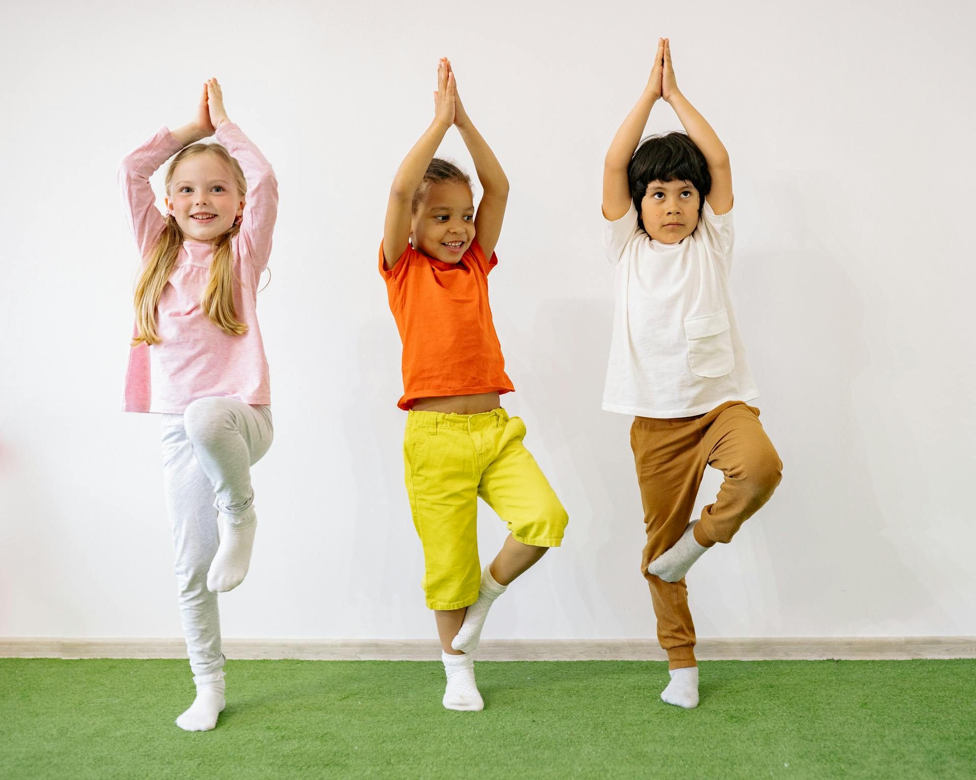 Young children doing yoga together