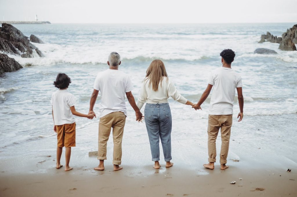 A family enjoying time on the beach.
