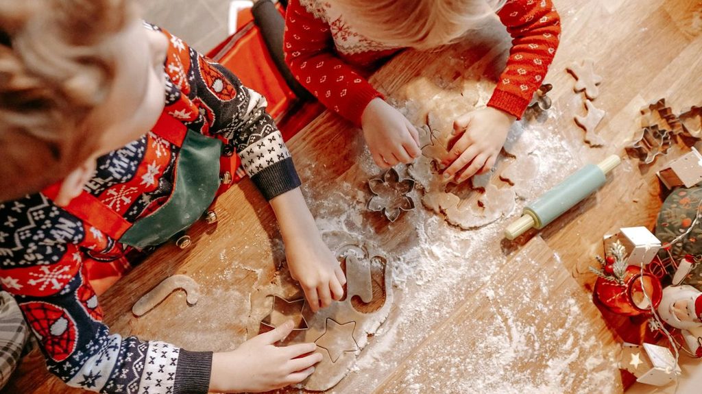 Kids having fun baking Christmas cookies