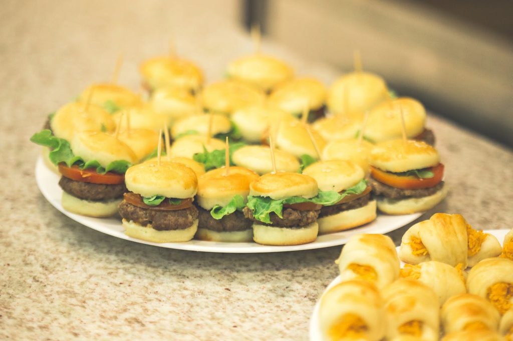 Mini burgers on a plate.