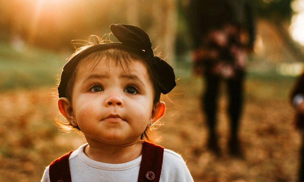 Toddler with black hair bow