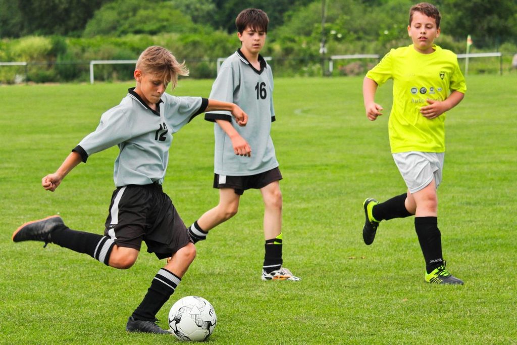 Kids playing soccer.