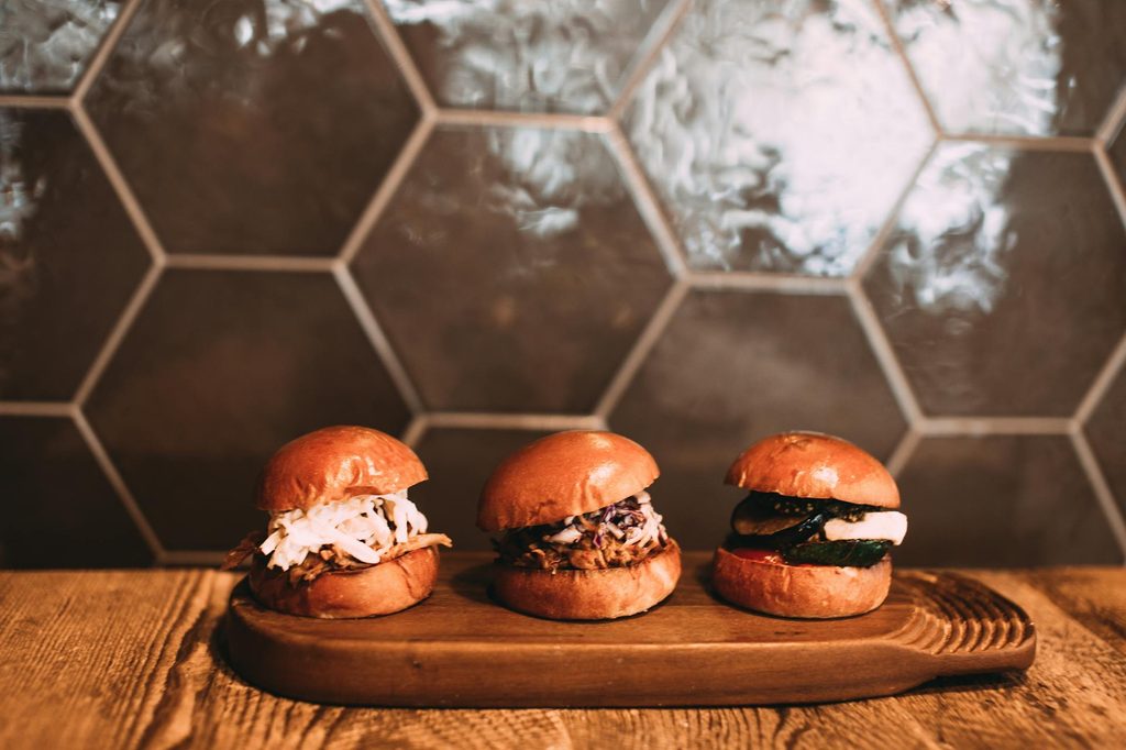 Slider sandwiches on a board.