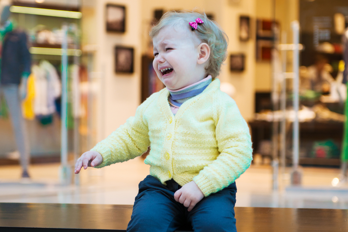 A toddler crying in a store.