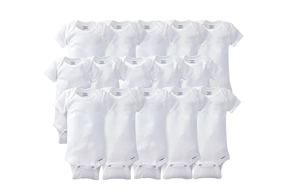 Rows of white baby onesies