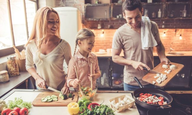 Family cooking together in the kitchen