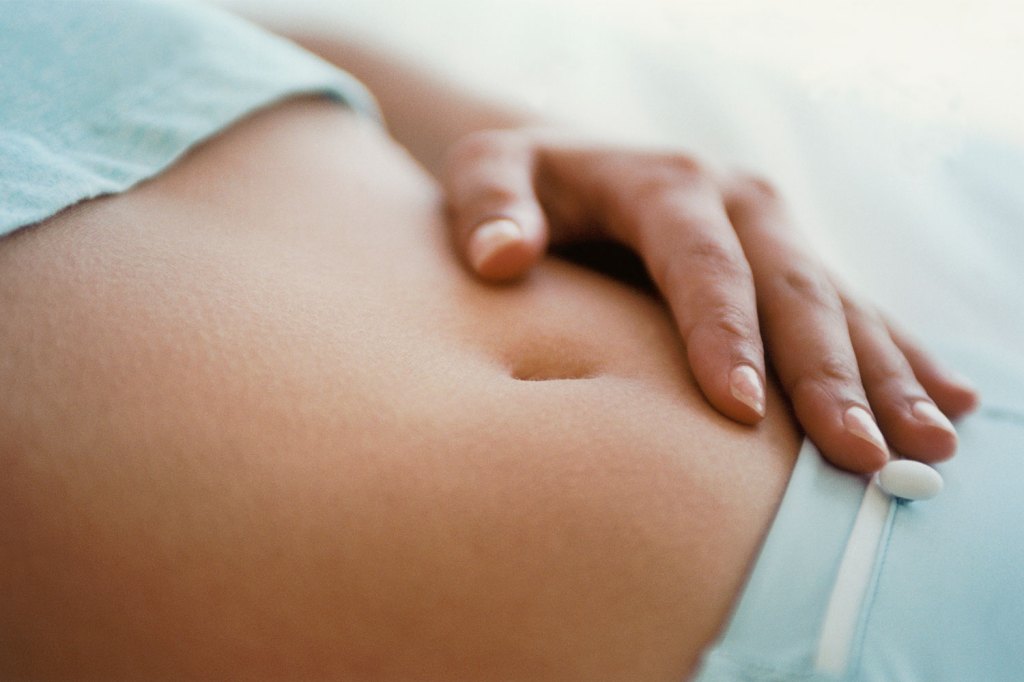 Woman touching her belly