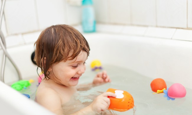 A child playing in the bath.