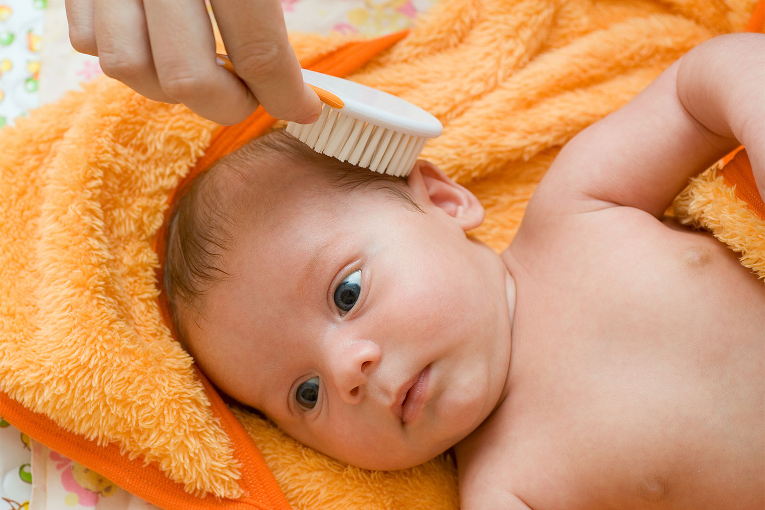 brushing baby hair